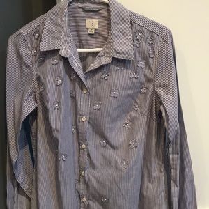 Blue striped button down blouse with flower detail